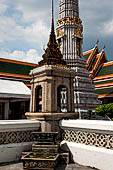 Bangkok Wat Pho, stone marker that delineates the sacred space of the bot with one of the phra prang tower at the corner of the courtyard. 